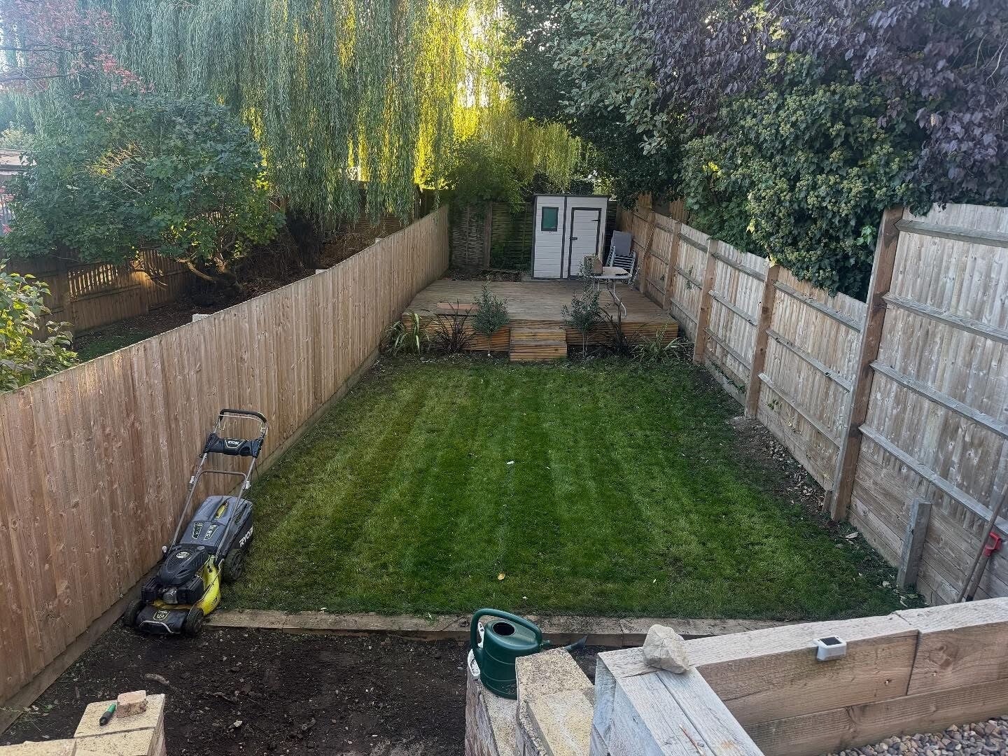 A garden lawn and fencing featured in Luke’s work portfolio